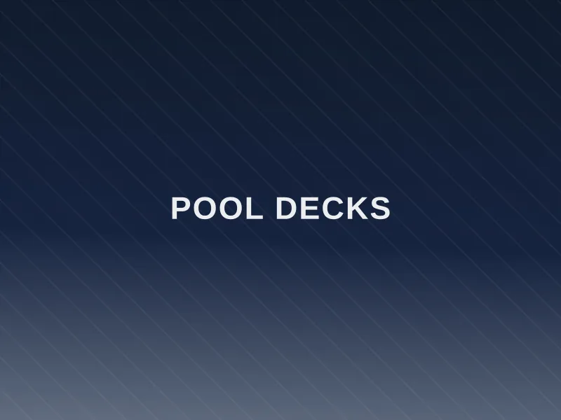 Textured concrete pool deck surrounding backyard pool